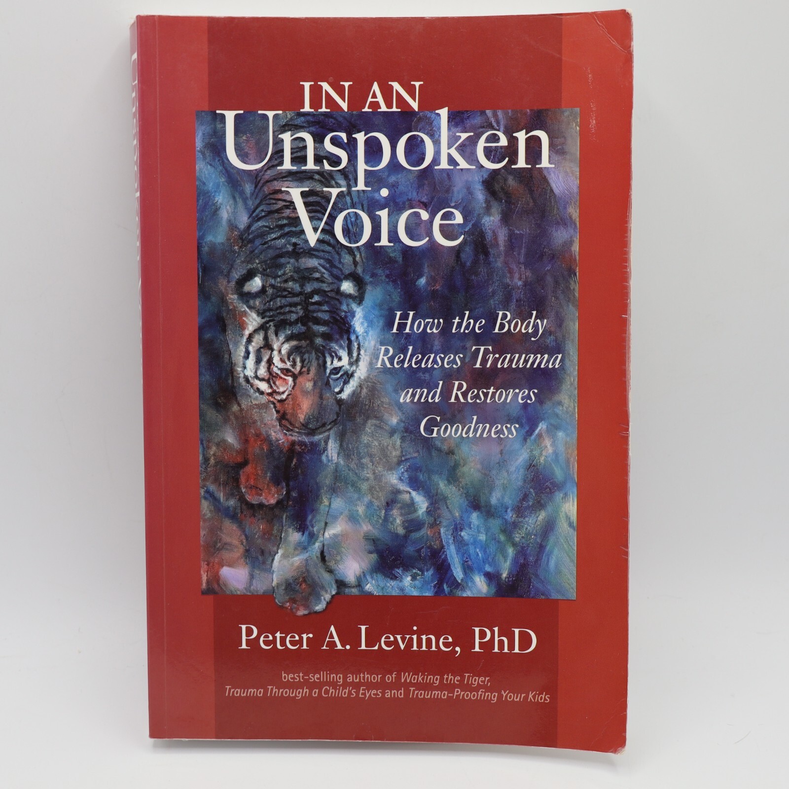 In an Unspoken Voice: How the Body Releases Trauma… Paperback By Peter Levine