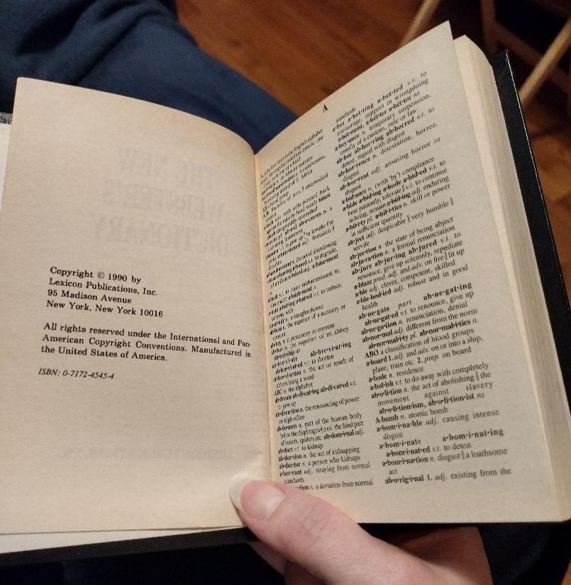 The New Webster’s Library of Practical Information desktop set of 7. Aged.
