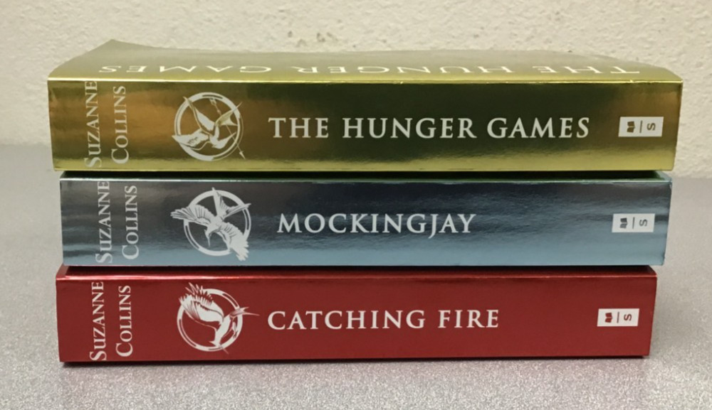 ​The Hunger Games Trilogy Foil Edition Set by Suzanne Collins TPB