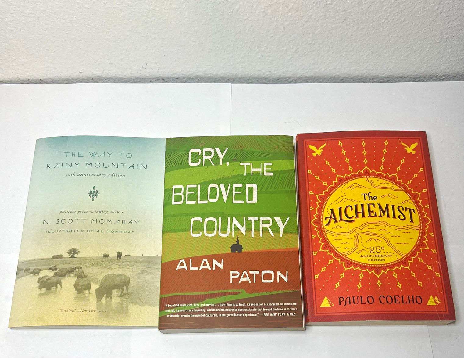 Lot of 3 Paperback Books: The Alchemist, Cry the Beloved Country, Rainy Mountain