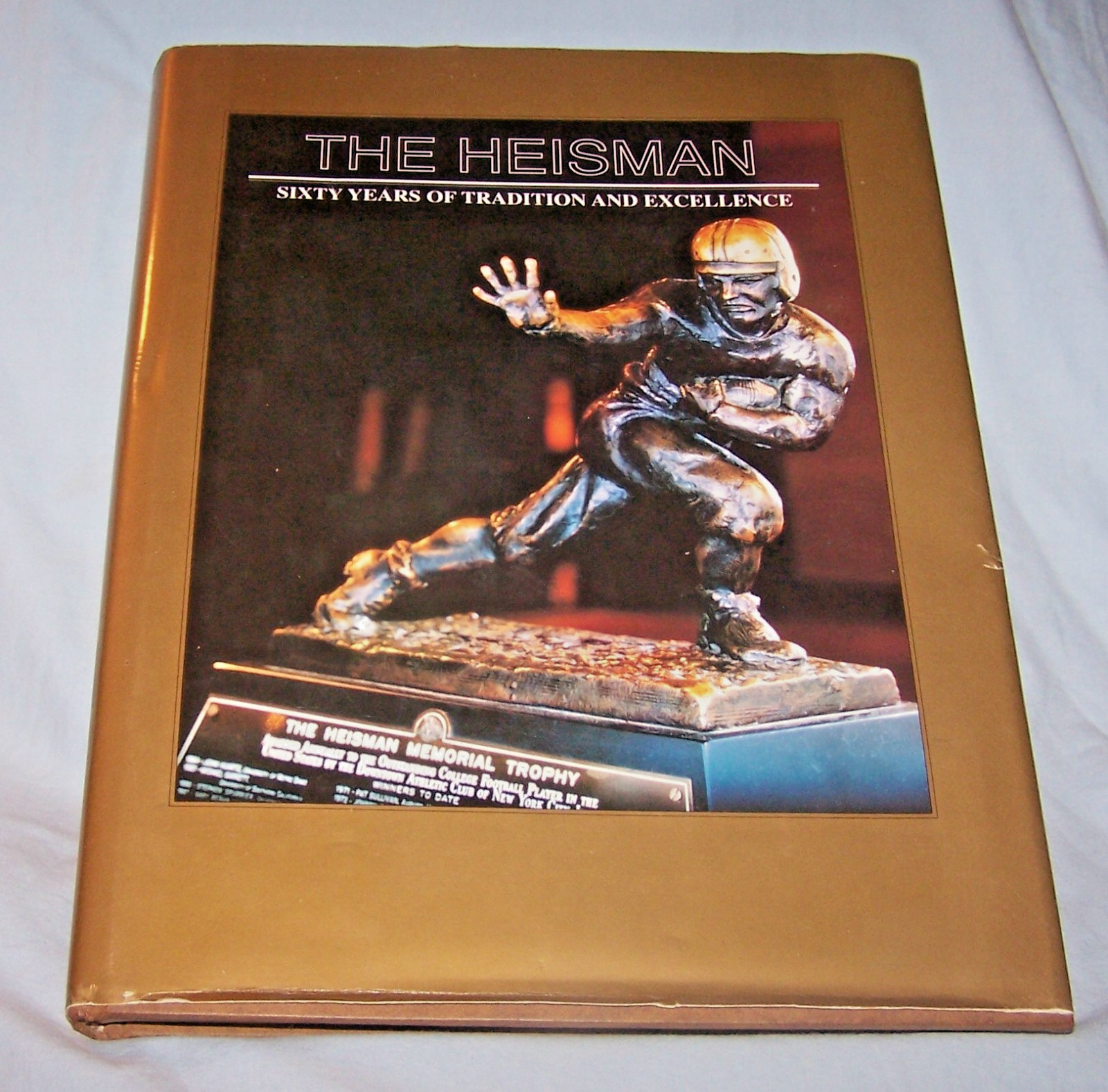 The Heisman-Sixty Years of Tradition, Excellence HB w/dj-242 pages-1995-1st Ed.